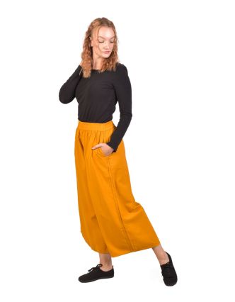 Pohodlné volné žluté tříčtvrteční kalhoty, guma v pase a kapsy