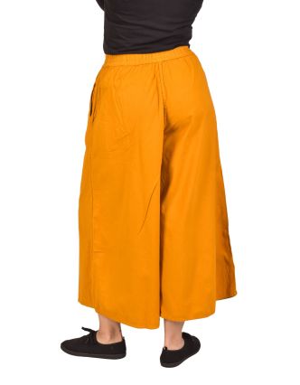 Pohodlné volné žluté tříčtvrteční kalhoty, guma v pase a kapsy